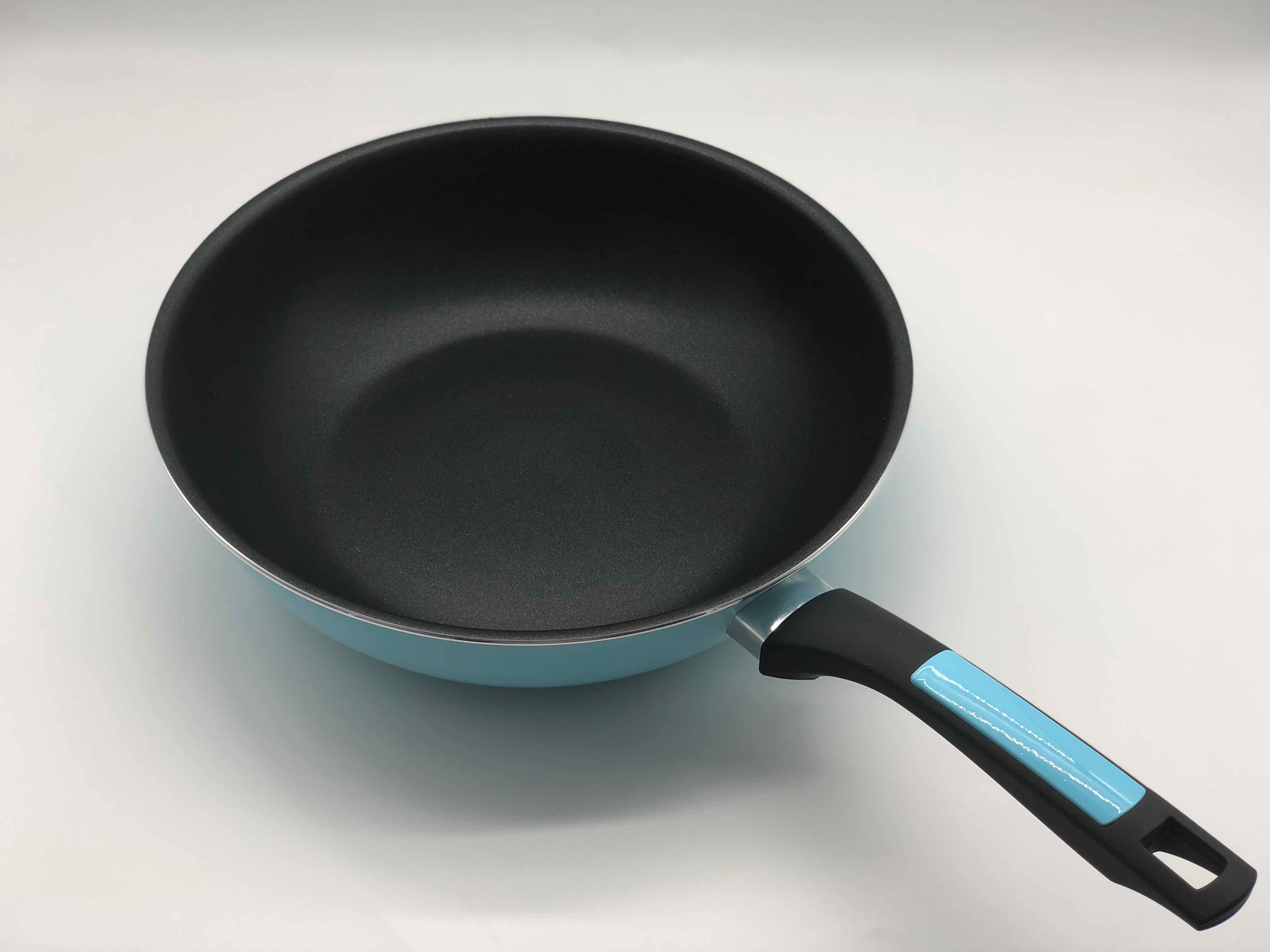 Pressed wok pan with blue handle